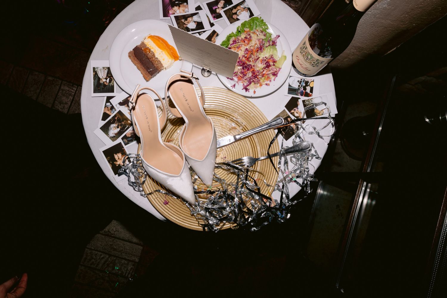 A collection of photos showing plates of food and drinks arranged on a restaurant table during a dining experience.
