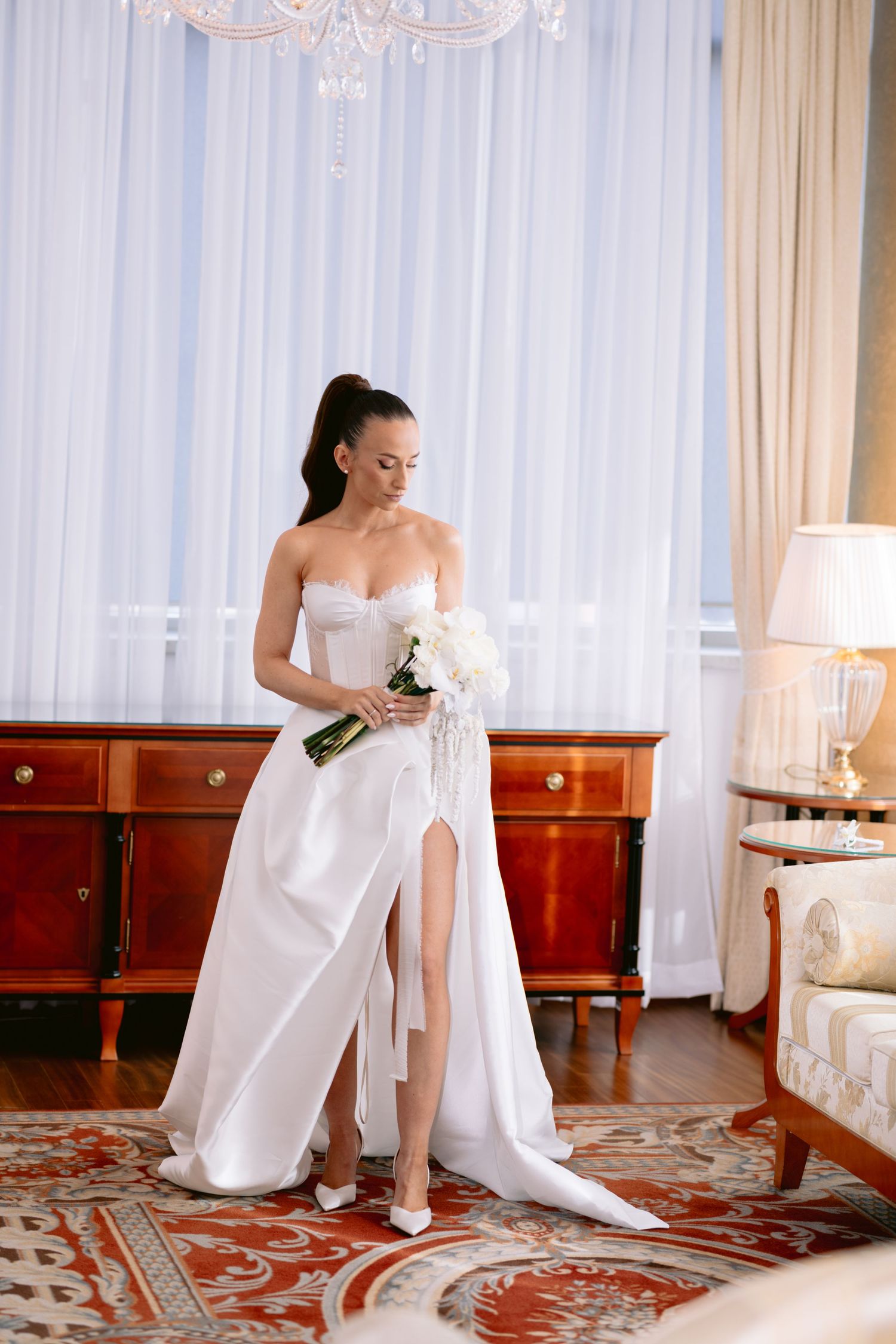 A series of photos showing a bride in a white wedding dress sitting on a patterned carpet in an elegant room.
