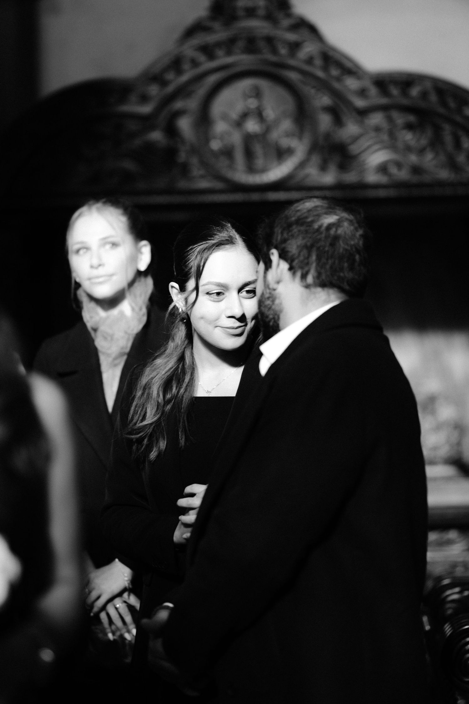 A romantic black and white photo series showing a couple in intimate moments together.