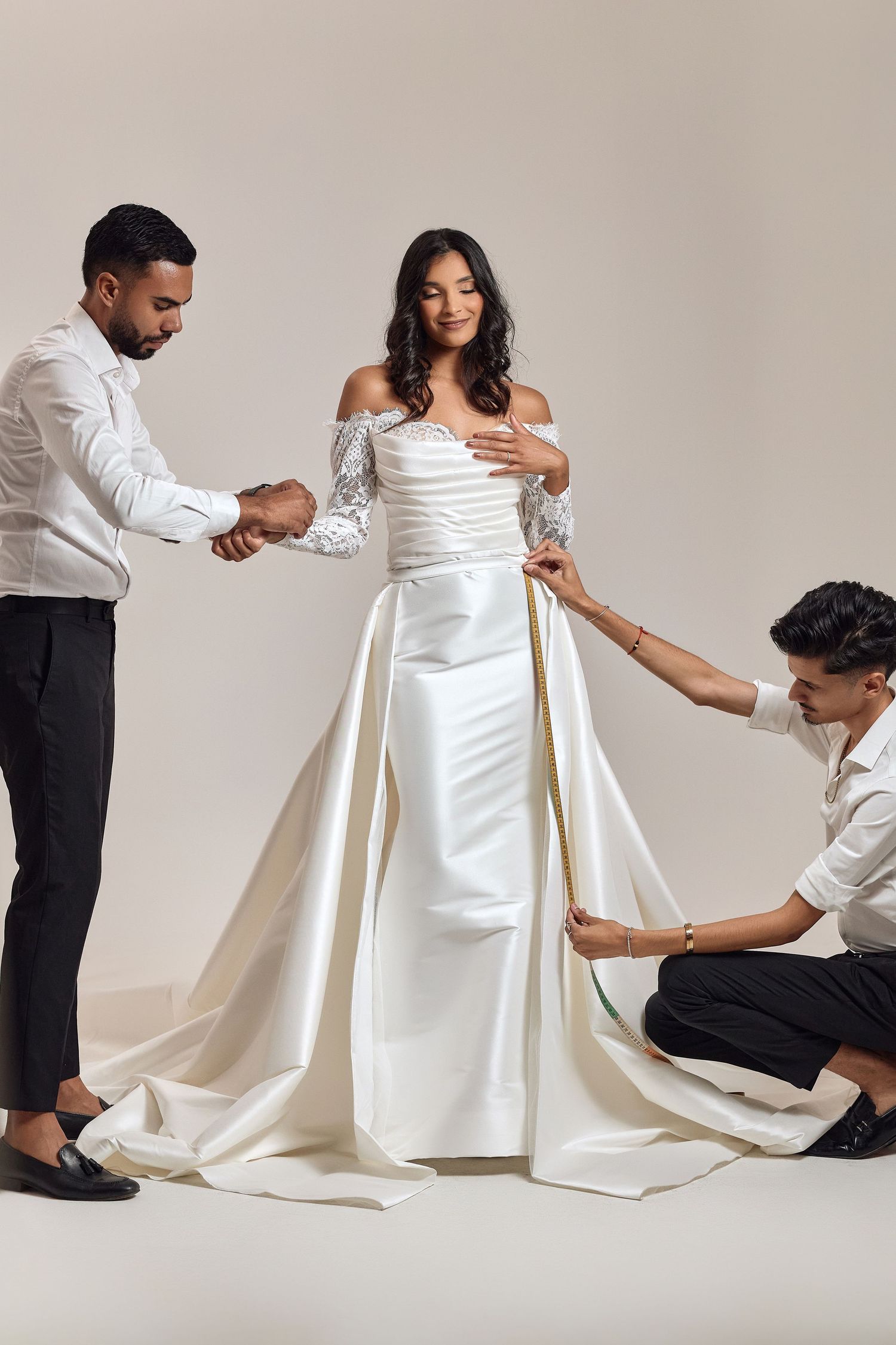 Series of elegant poses showing preparation and adjustments of a white formal dress.