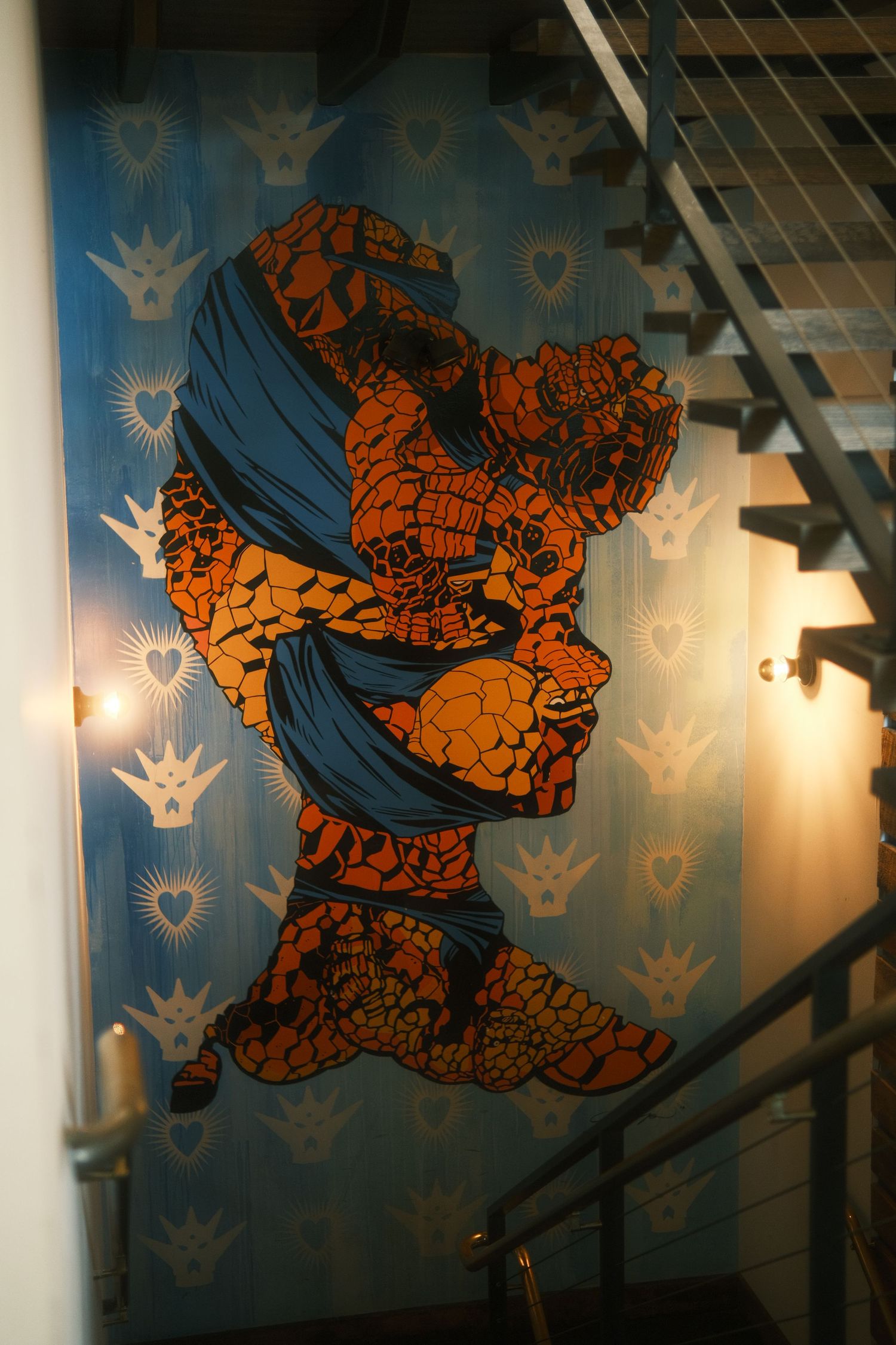 Retro comic book style artwork of The Thing character from Marvel's Fantastic Four displayed on a blue wall with lighting.