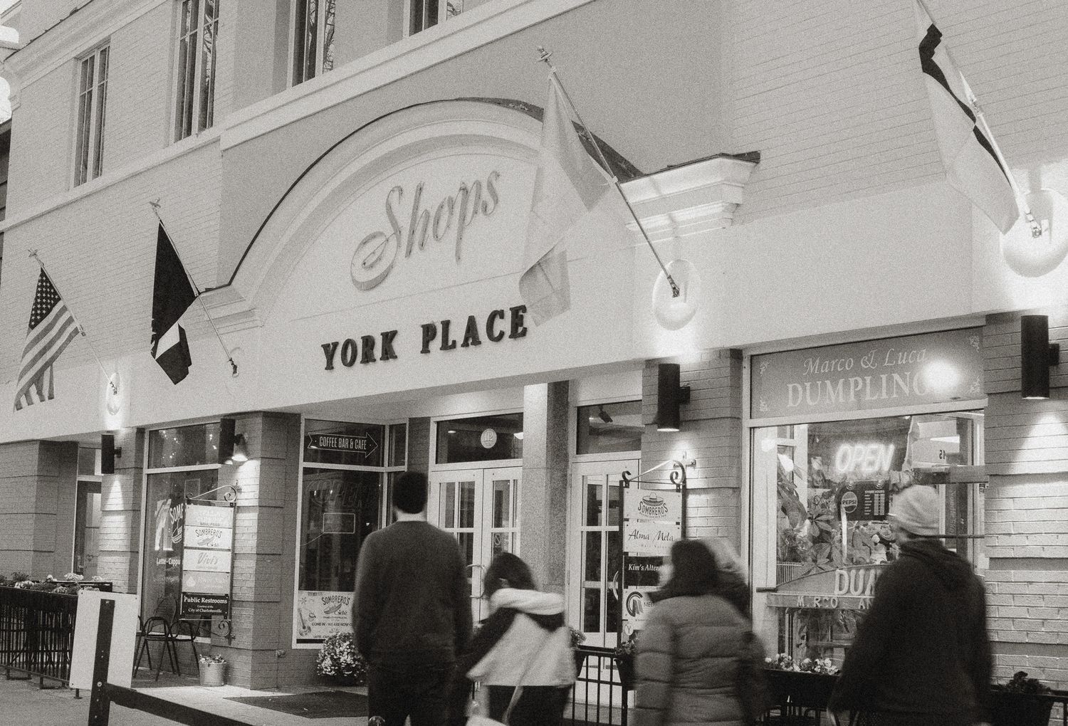 Vintage photograph of Shaps York Place storefront with customers entering the establishment.