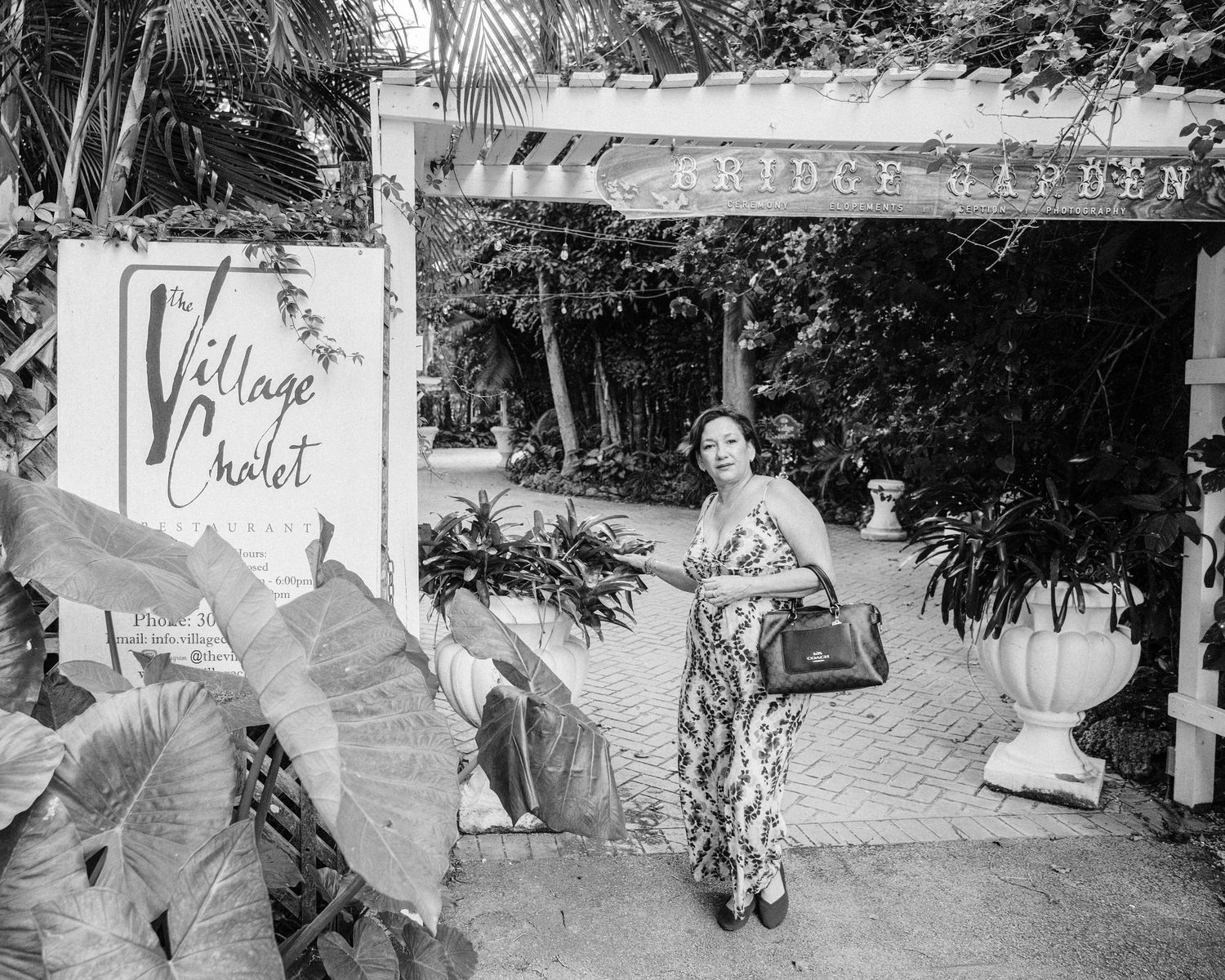 A black and white collage of street scenes showing various signs and graffiti in an urban environment.
