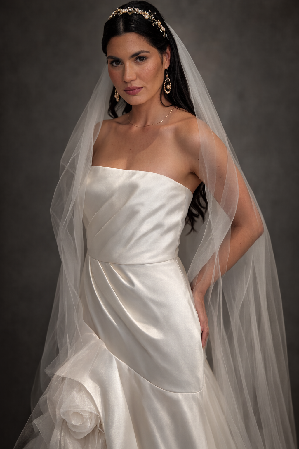 Elegant bridal portrait series showing a classic white strapless wedding gown with flowing veil against dark background.