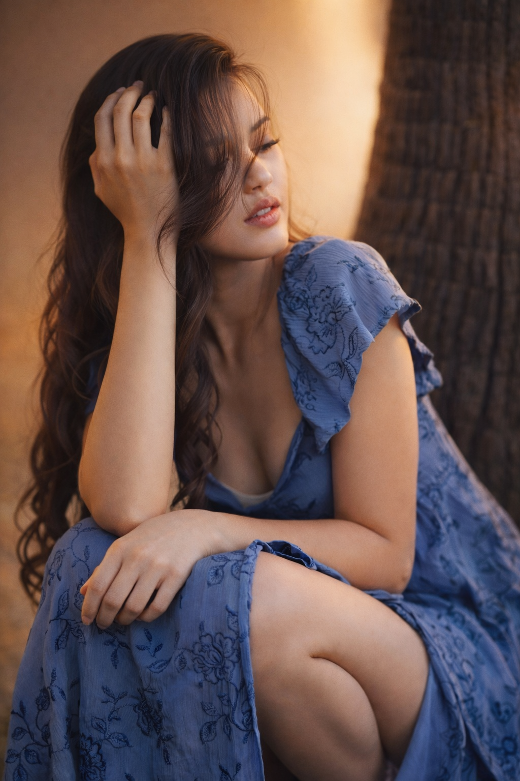 A series of artistic portraits showing a figure in a blue lace dress against a warm-toned background.