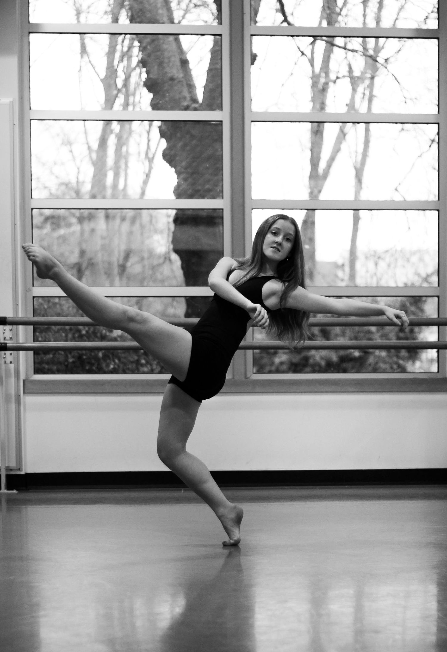 Balance and breath. A dancer finds her center against the backdrop of a winter morning. Movement captured in its most elegant, raw form.