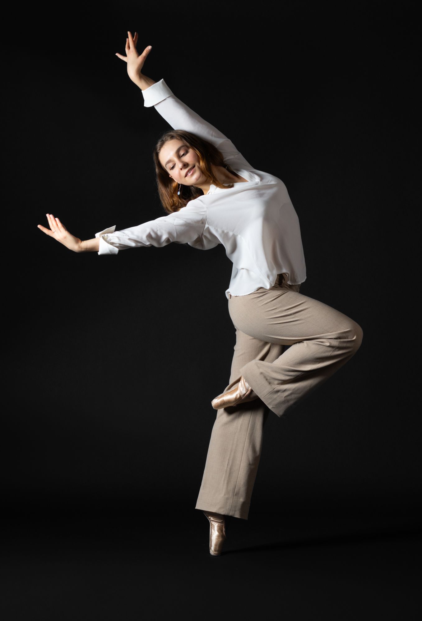 Elegant dance portraiture featuring fluid movement and expressive posing. Professional studio photography for branding and social media.