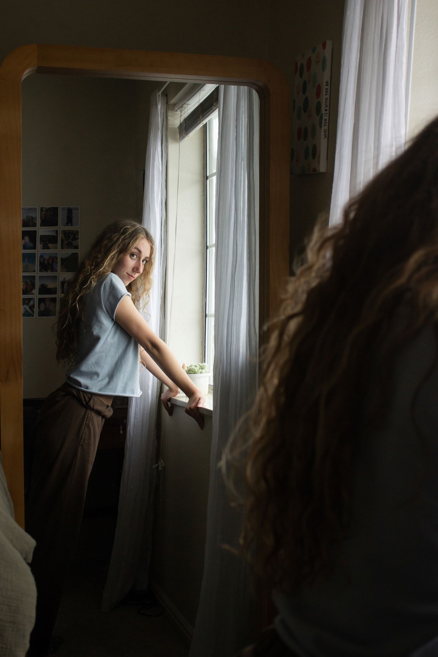 Capturing soft, natural light and intimate storytelling: A lifestyle portrait through a mirror, perfect for authentic brand narratives.