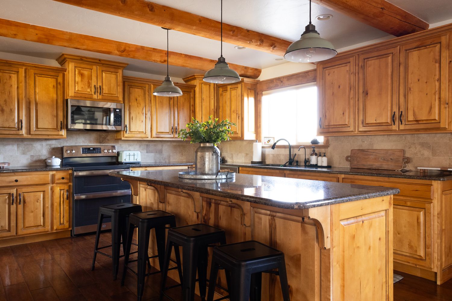 Bright, spacious lodge-style kitchen. Professional interior photography for hospitality branding, vacation homes, and lifestyle marketing.