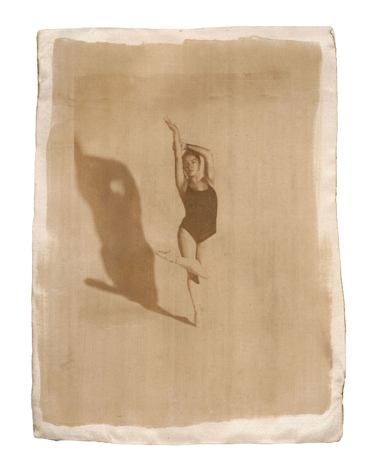 Van Dyke Brown print on satin. Capturing the fluid motion of dance through archival textures. Fine art and luxury textile photography.