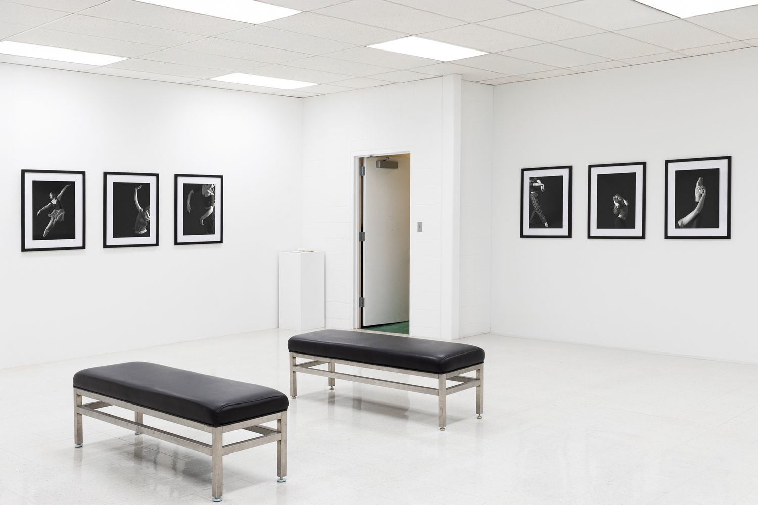 Atmospheric study of a modern art space. Exploration of white space and symmetry. Professional gallery photography.