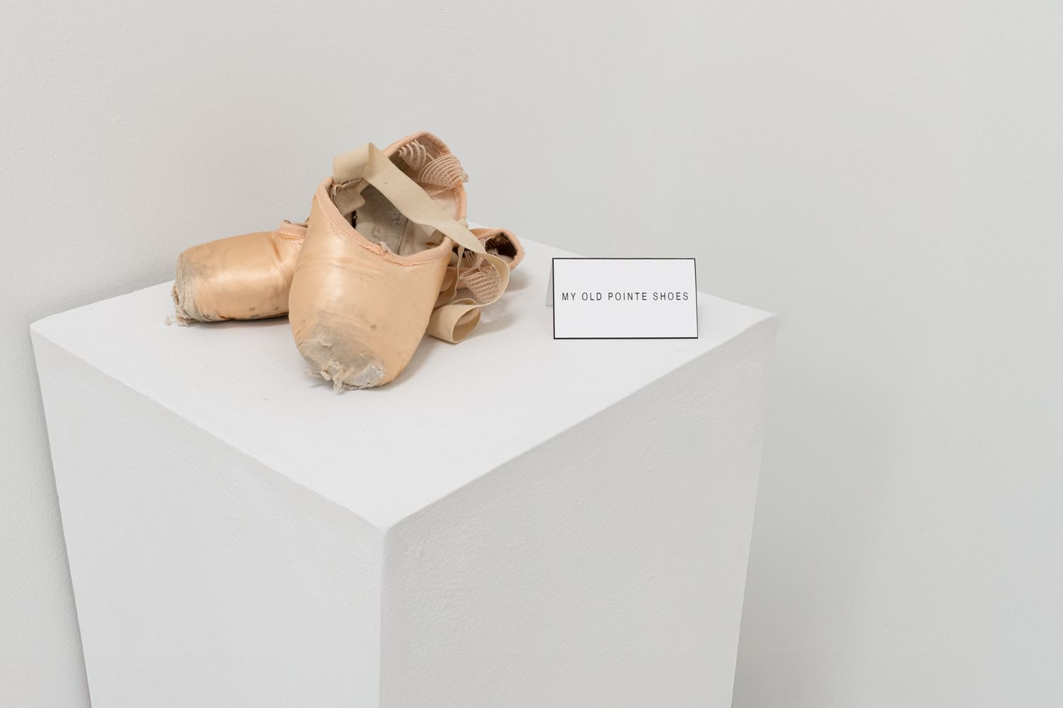 Clean studio shot of a gallery artifact. Capturing the personal history and 