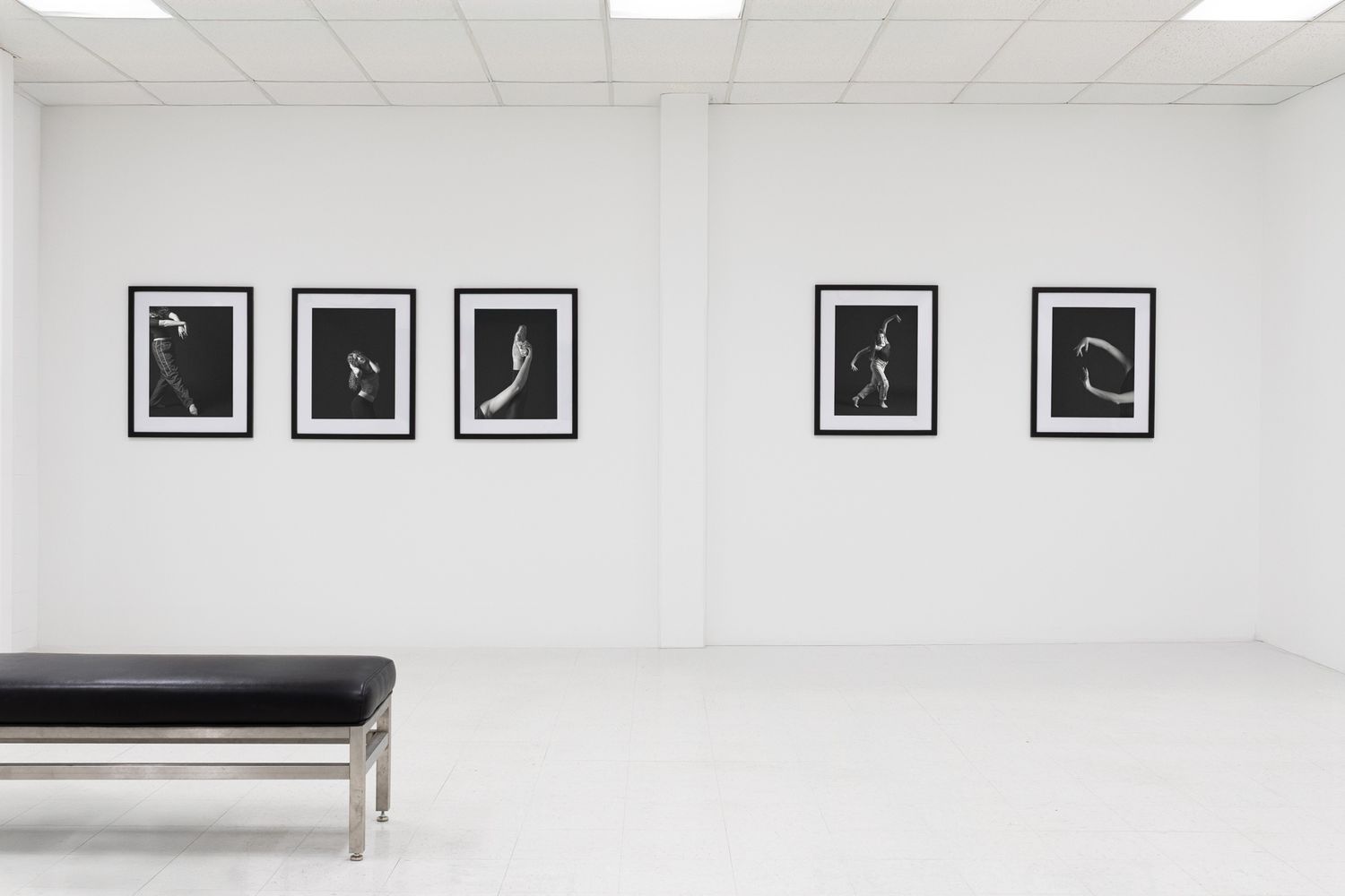 Atmospheric study of a modern art space. Exploration of white space and symmetry. Professional gallery photography.