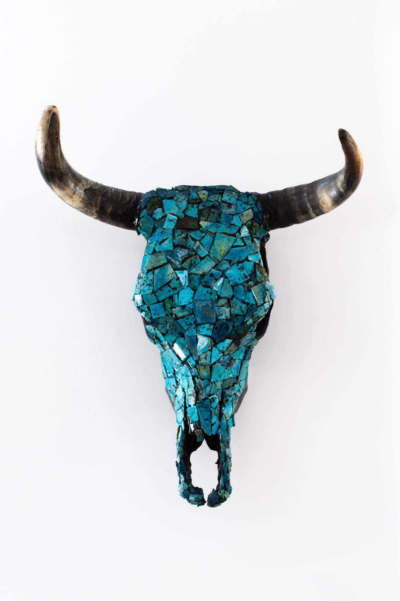 Exquisite turquoise mosaic bull skull sculpture. Handcrafted Western fine art with intricate stone detailing. Premium studio photography.
