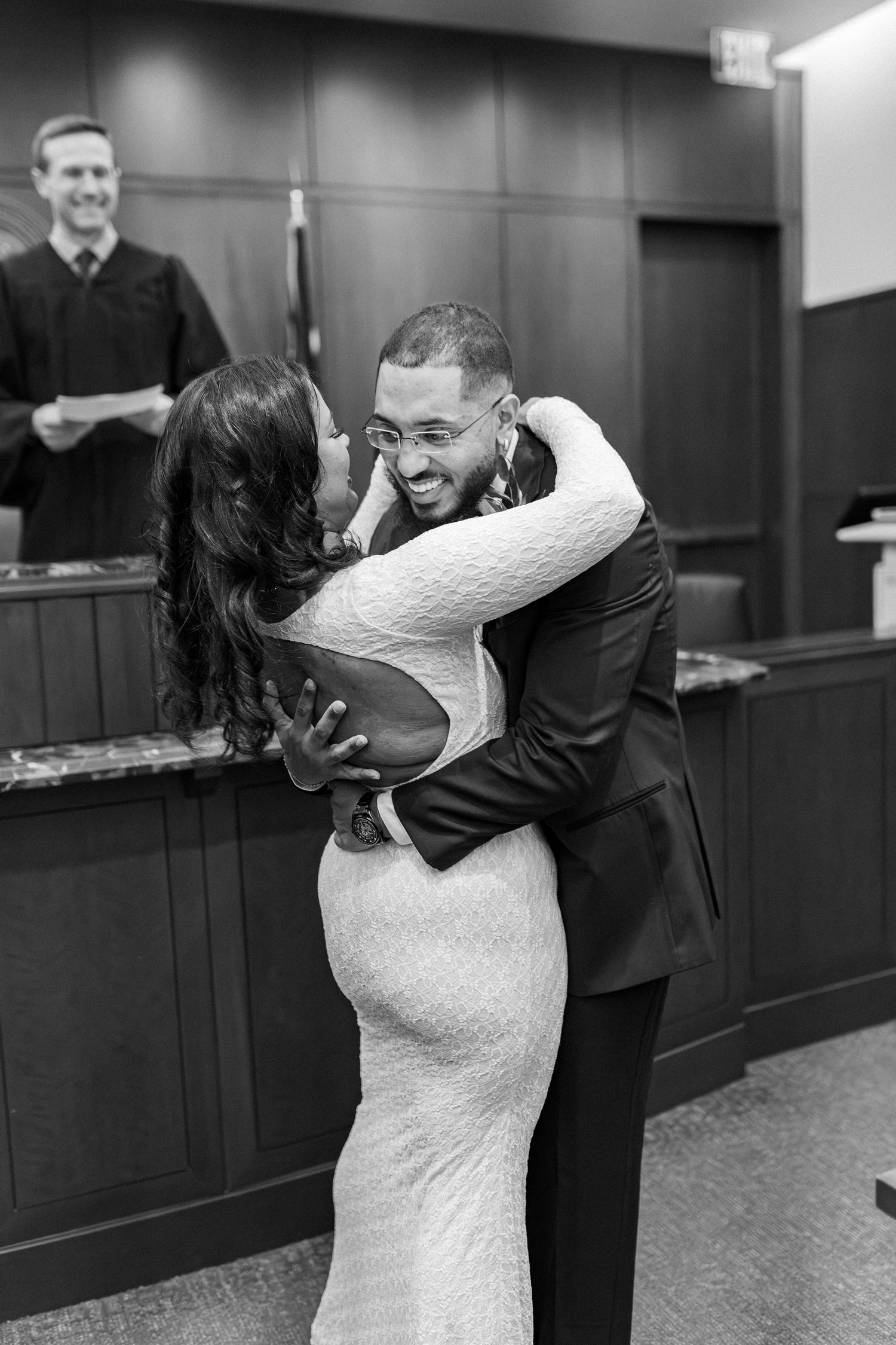 A black and white photo sequence showing a couple sharing their first dance at a wedding reception.