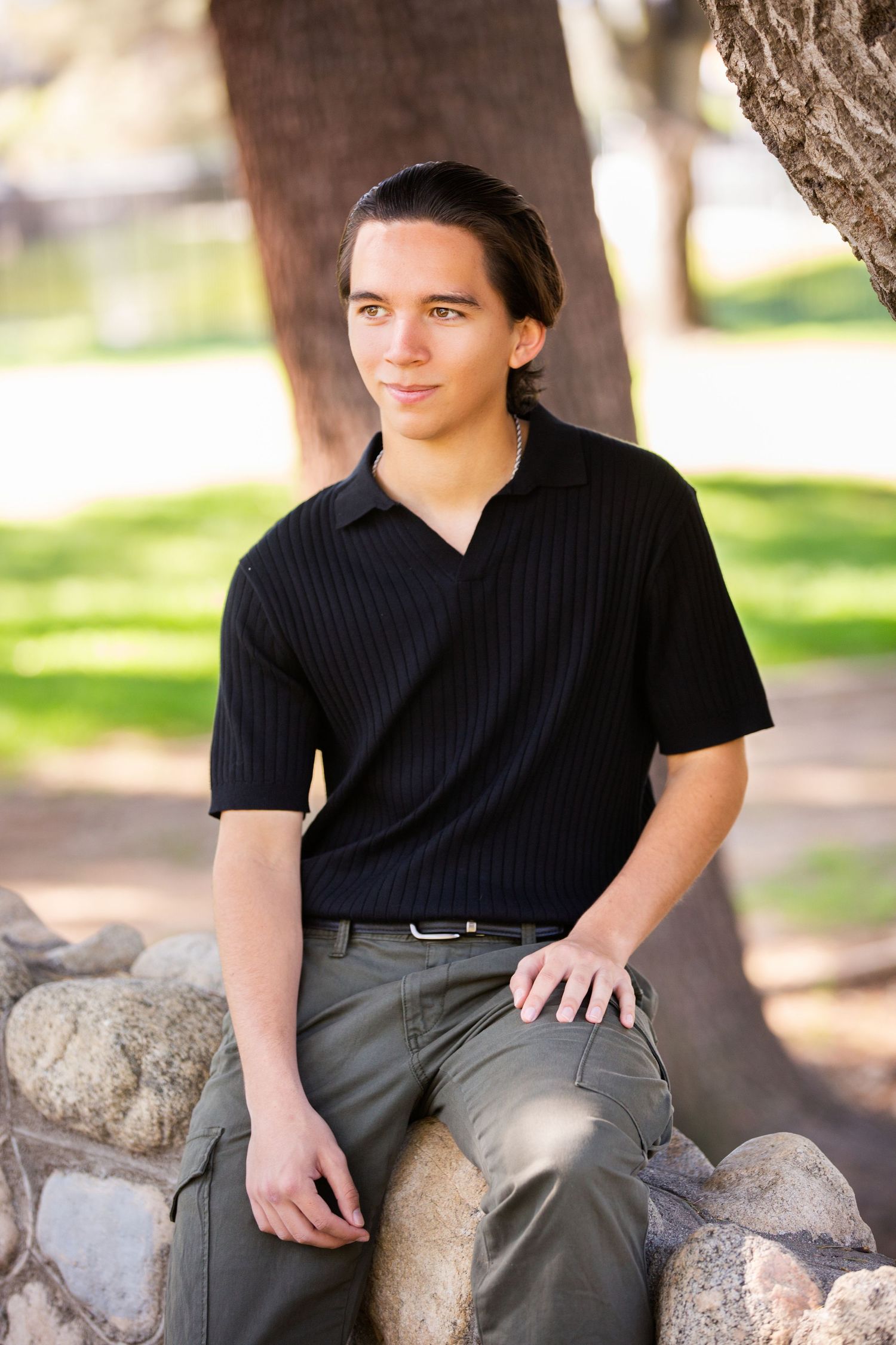 Casual Senior Portrait on park stone wall outdoors. Rancho Cucamonga, CA. Outdoor nature portraits.