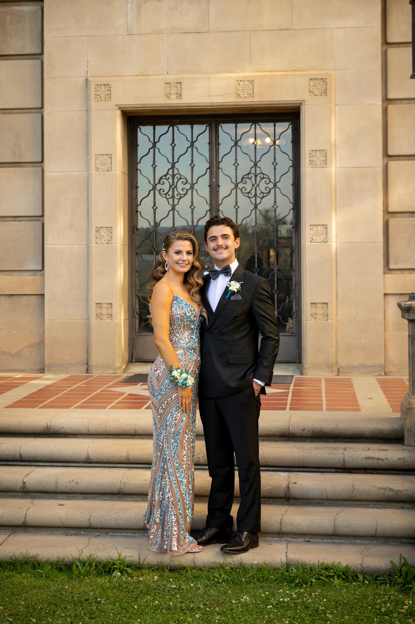 Senior prom Couple in formal wear posing in front of U of R building, Redlands CA. Redlands Business