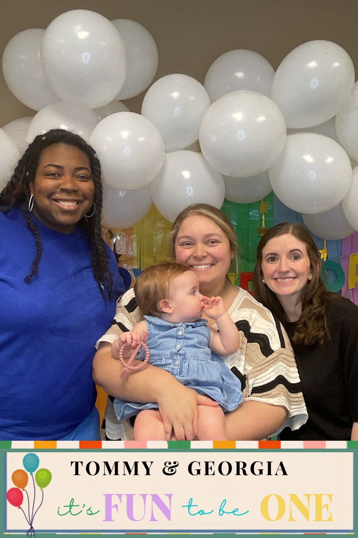 Three women posing with baby girl at Tommy & Georgia's colorful first birthday celebration.