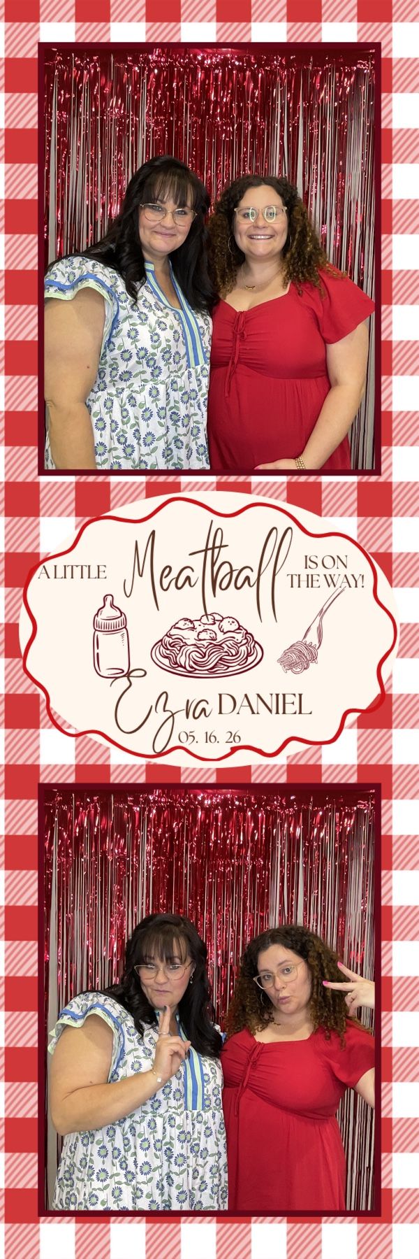 Two women pose playfully at Ezra Daniel baby shower photo booth with red metallic fringe and gingham border.