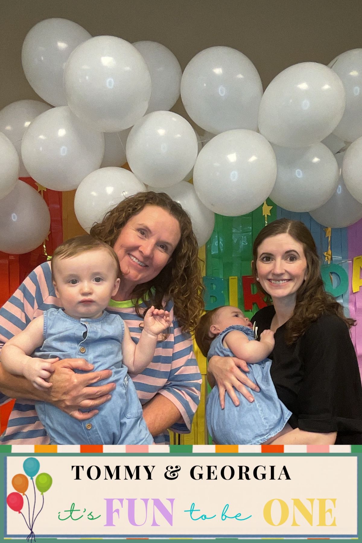 Two women each holding a twin baby at Tommy & Georgia's first birthday celebration.