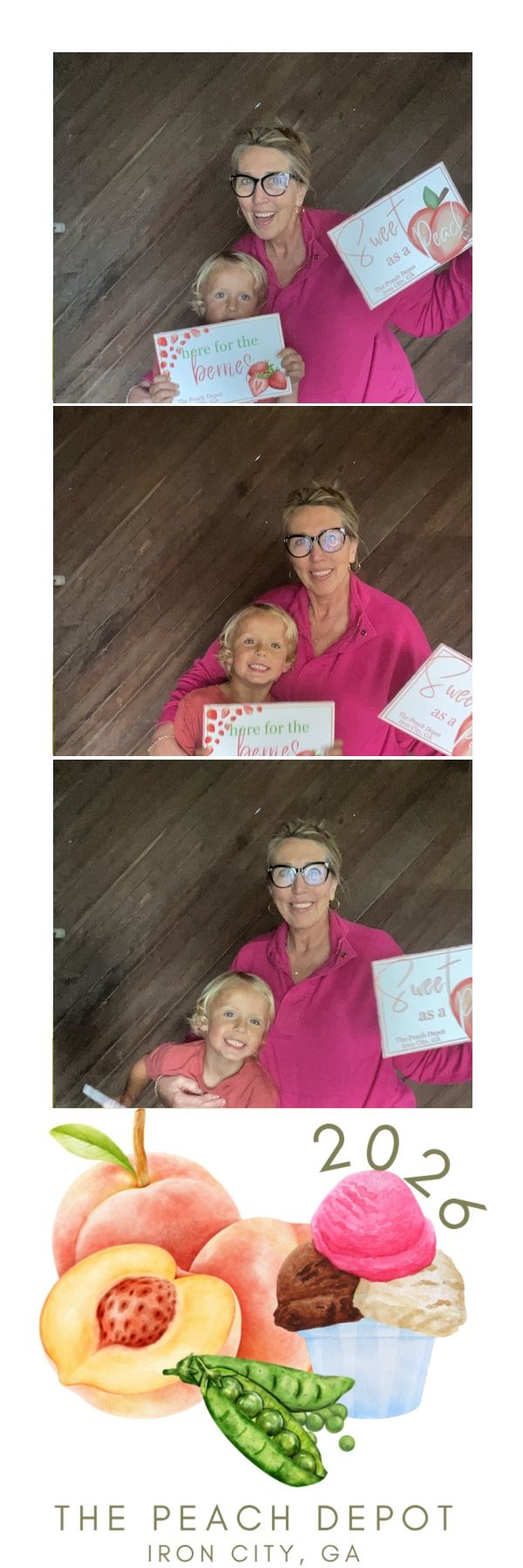 Woman in pink with child holding peach-themed signs at The Peach Depot photo booth, Iron City, GA 2026.