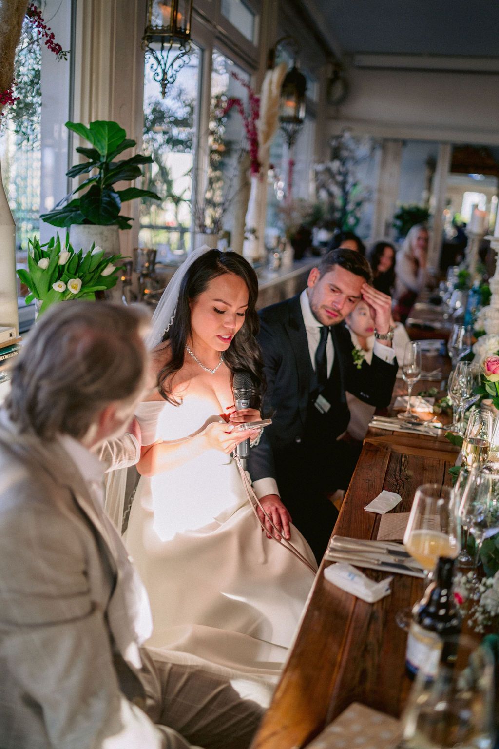 A sequence of wedding reception photos showing a joyful moment between couple at a decorated indoor venue.