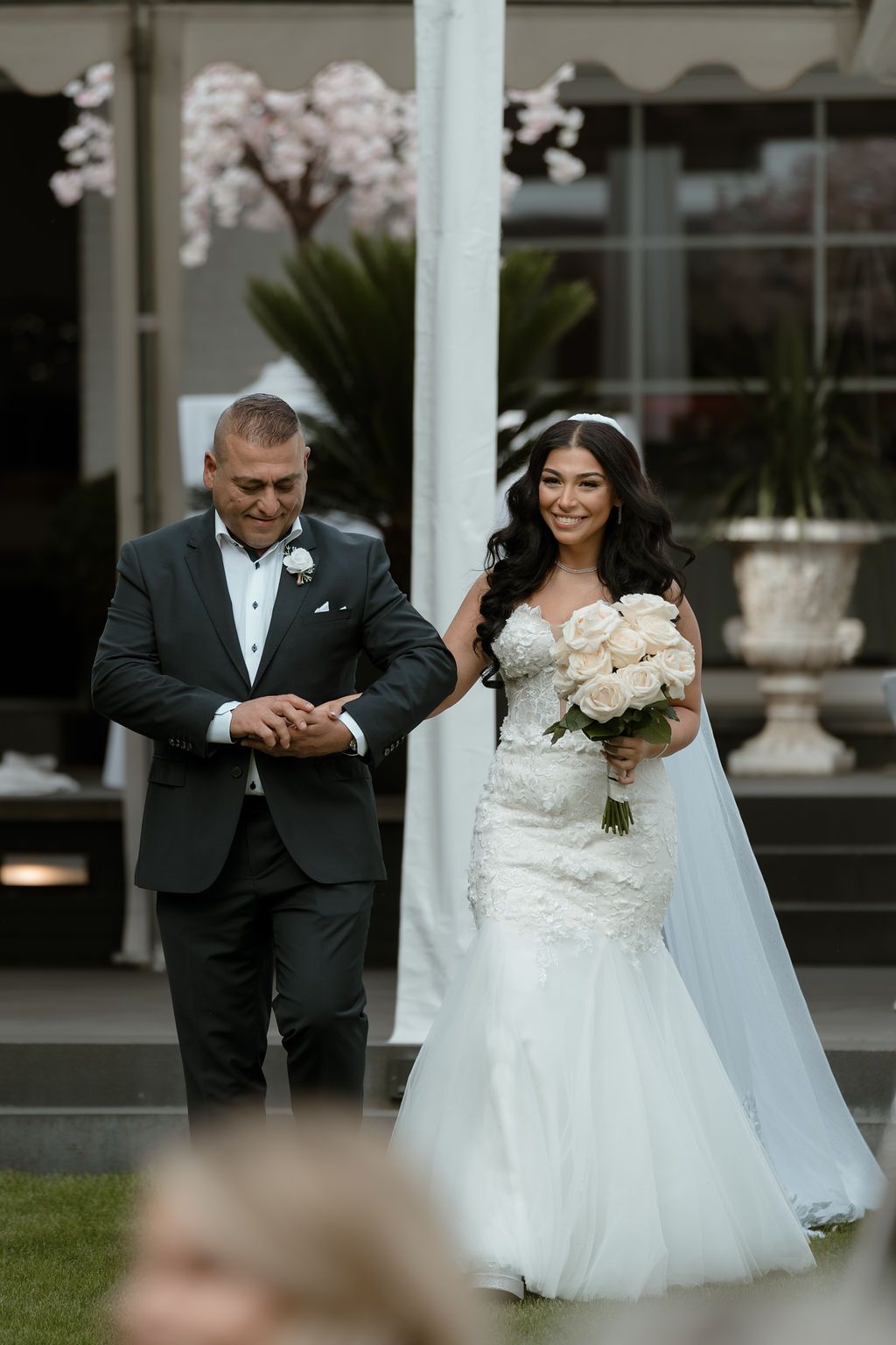 Romantic wedding moments captured in a series of four elegant outdoor photos showing a bride and groom in formal attire.