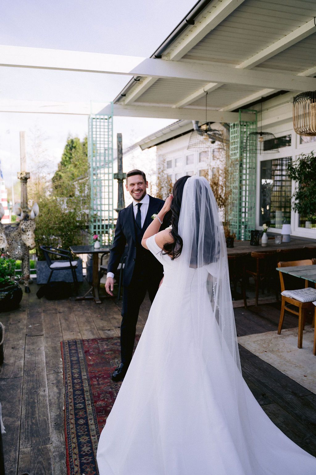 A sequence of romantic wedding photos shows a couple in white dress and suit dancing together on an outdoor patio.