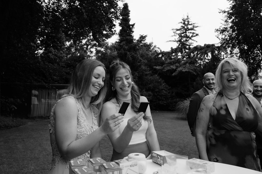 A series of black and white photos showing laughter and joyful moments at an outdoor party.