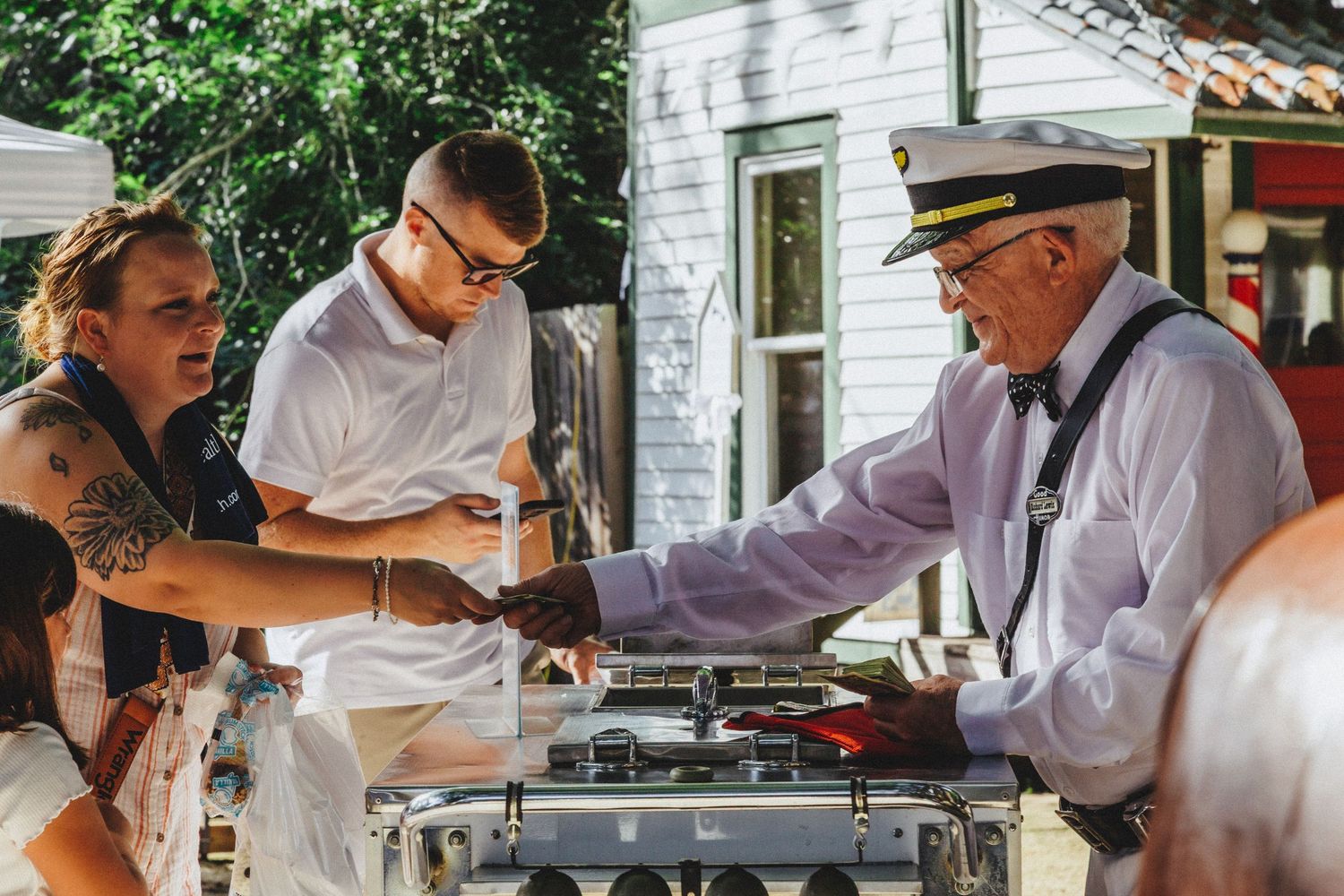 Street photography by Robert Paul | Ice cream man White Linen Festival in League City, Texas, 2025