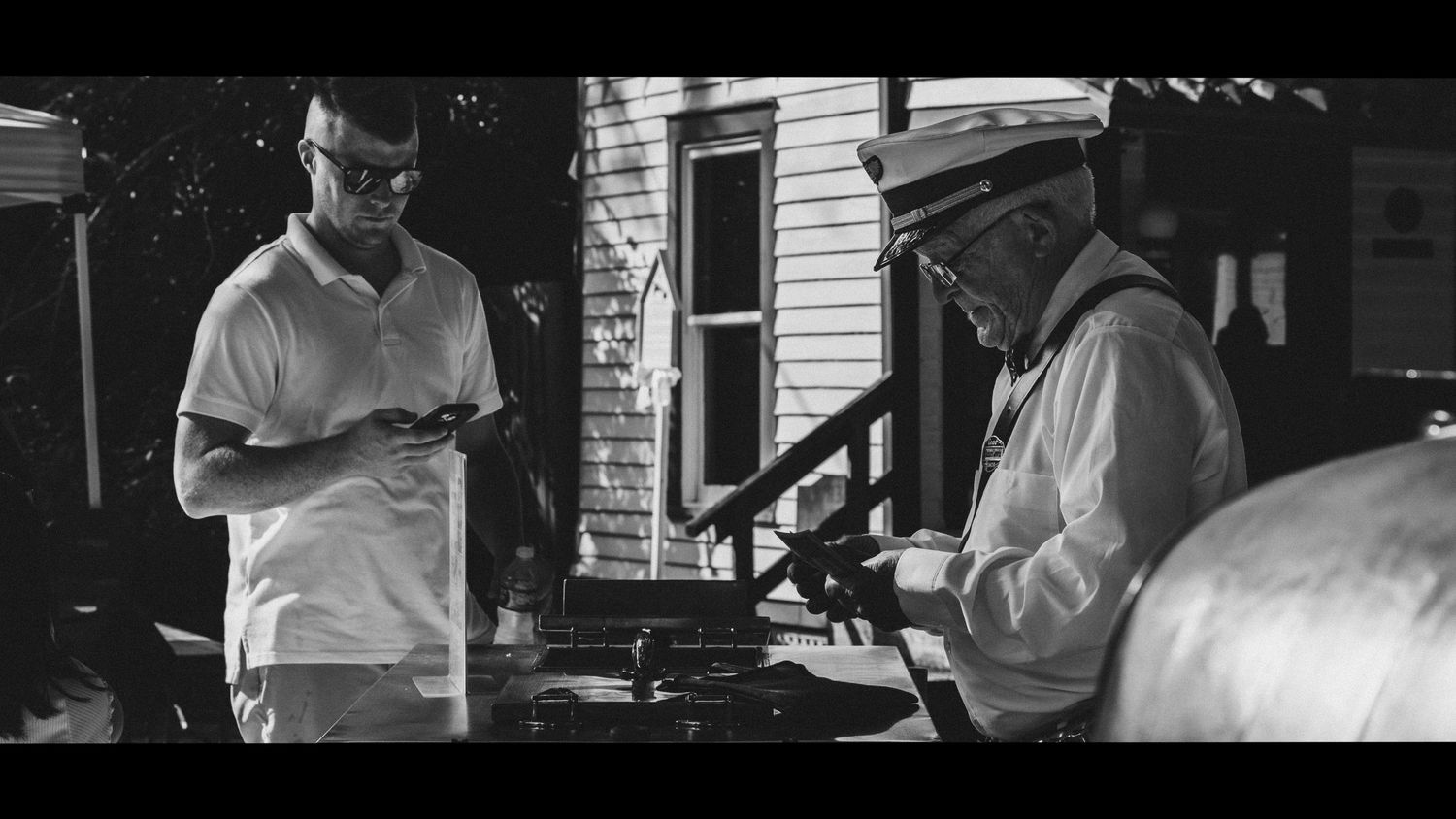 Street photography by Robert Paul | Ice cream man White Linen Festival in League City, Texas, 2025
