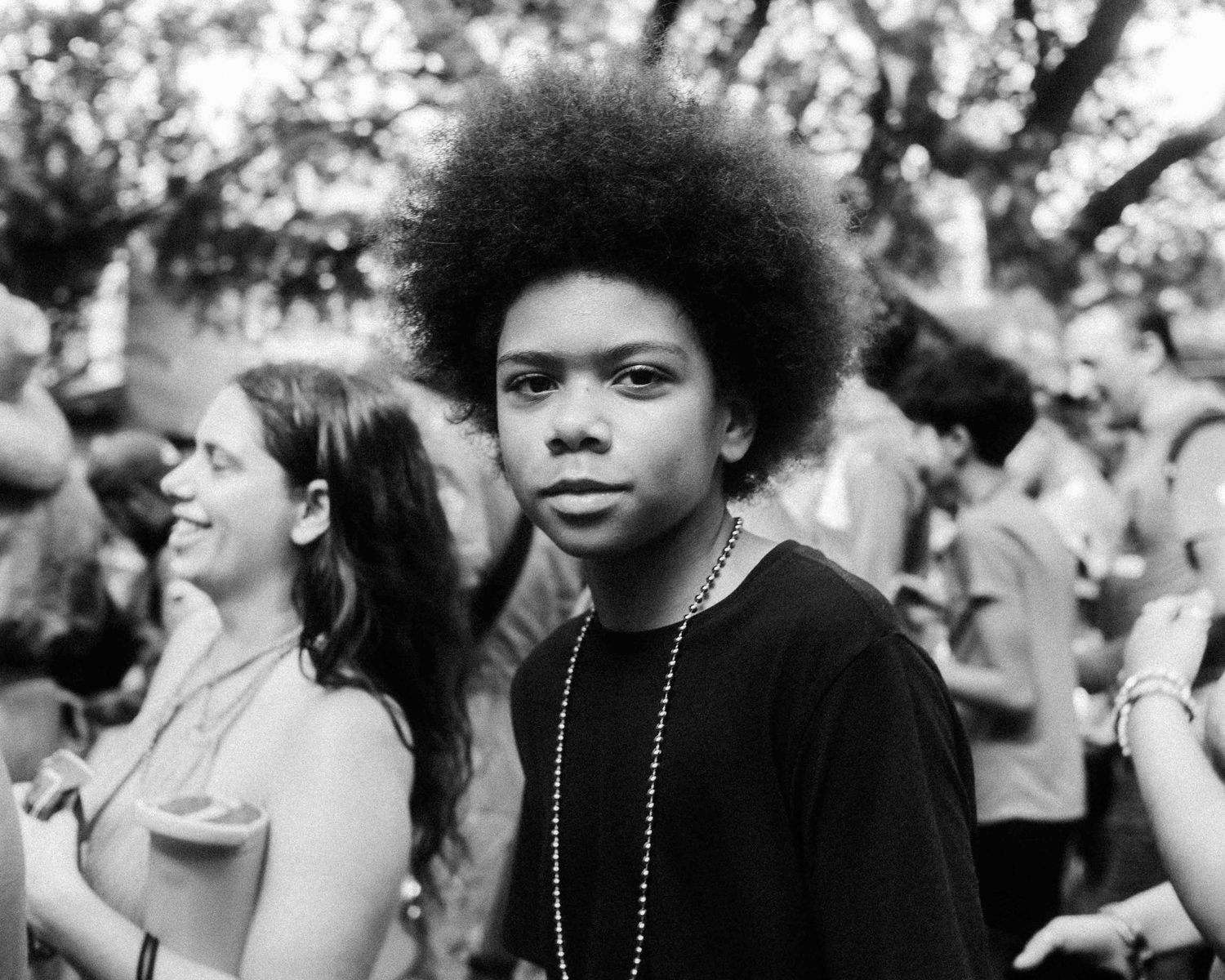 FIFA World Cup 2026 Houston | Kid poses for street portrait during the Orange Bus fan walk | Photos by Robert Paul