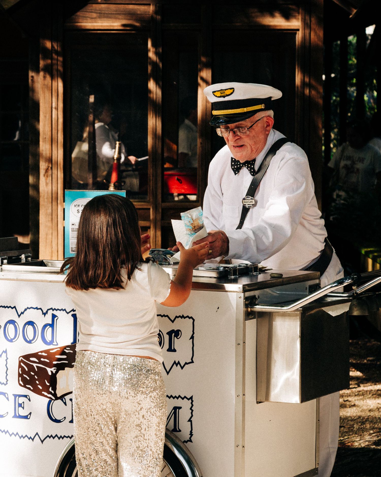 Street photography by Robert Paul | Ice cream man White Linen Festival in League City, Texas, 2025