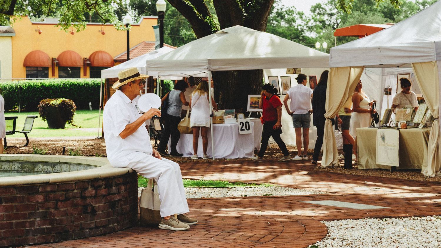Street photography by Robert Paul | Man relaxing White Linen Festival in League City, Texas, 2025