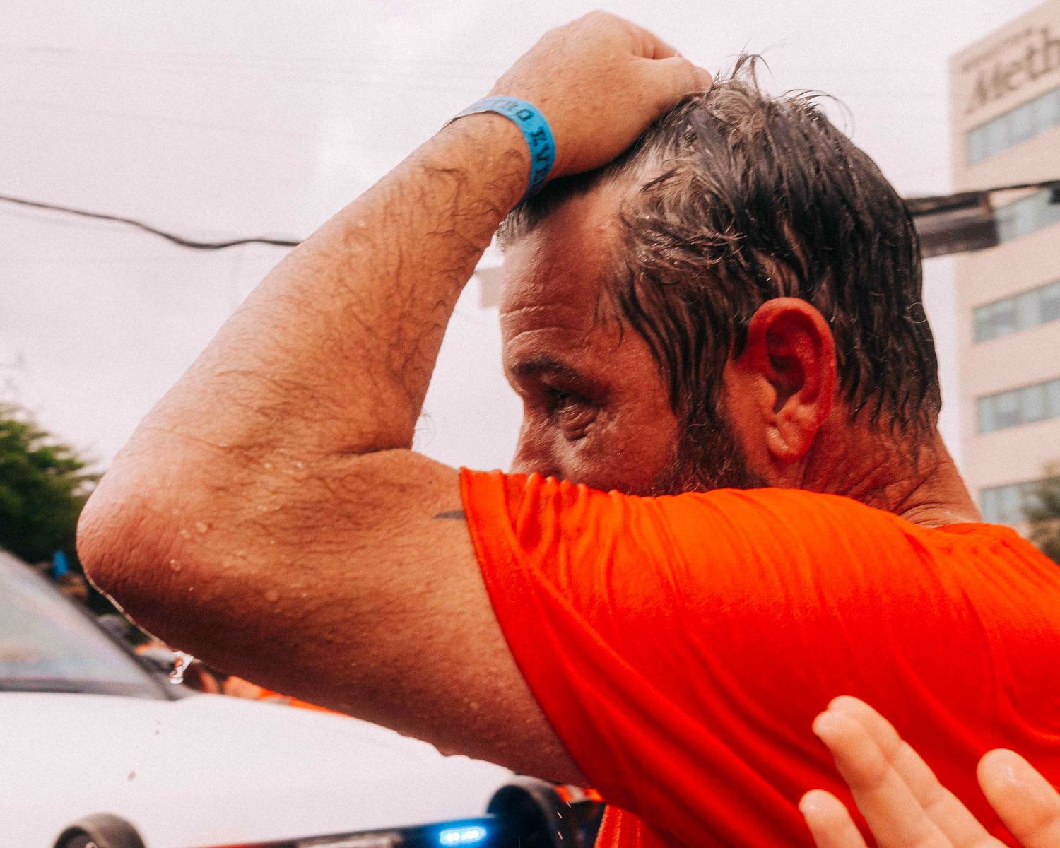FIFA World Cup 2026 Houston | Fan after cooling off from the HFD firehose spray Orange Bus fan walk | Photos by Robert Paul