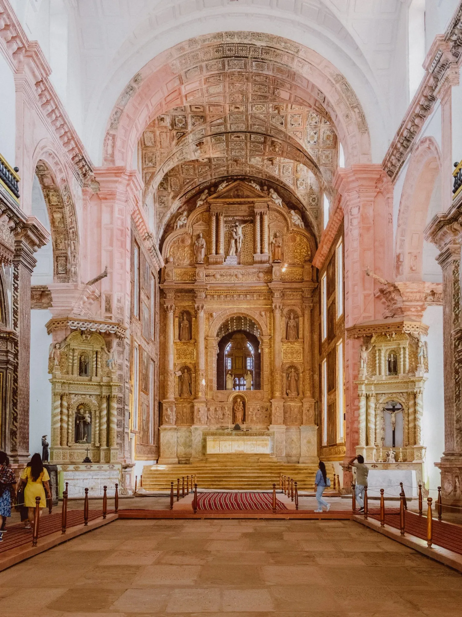 Ornate golden baroque altar inside historic Basilica of Bom Jesus church in Old Goa India.