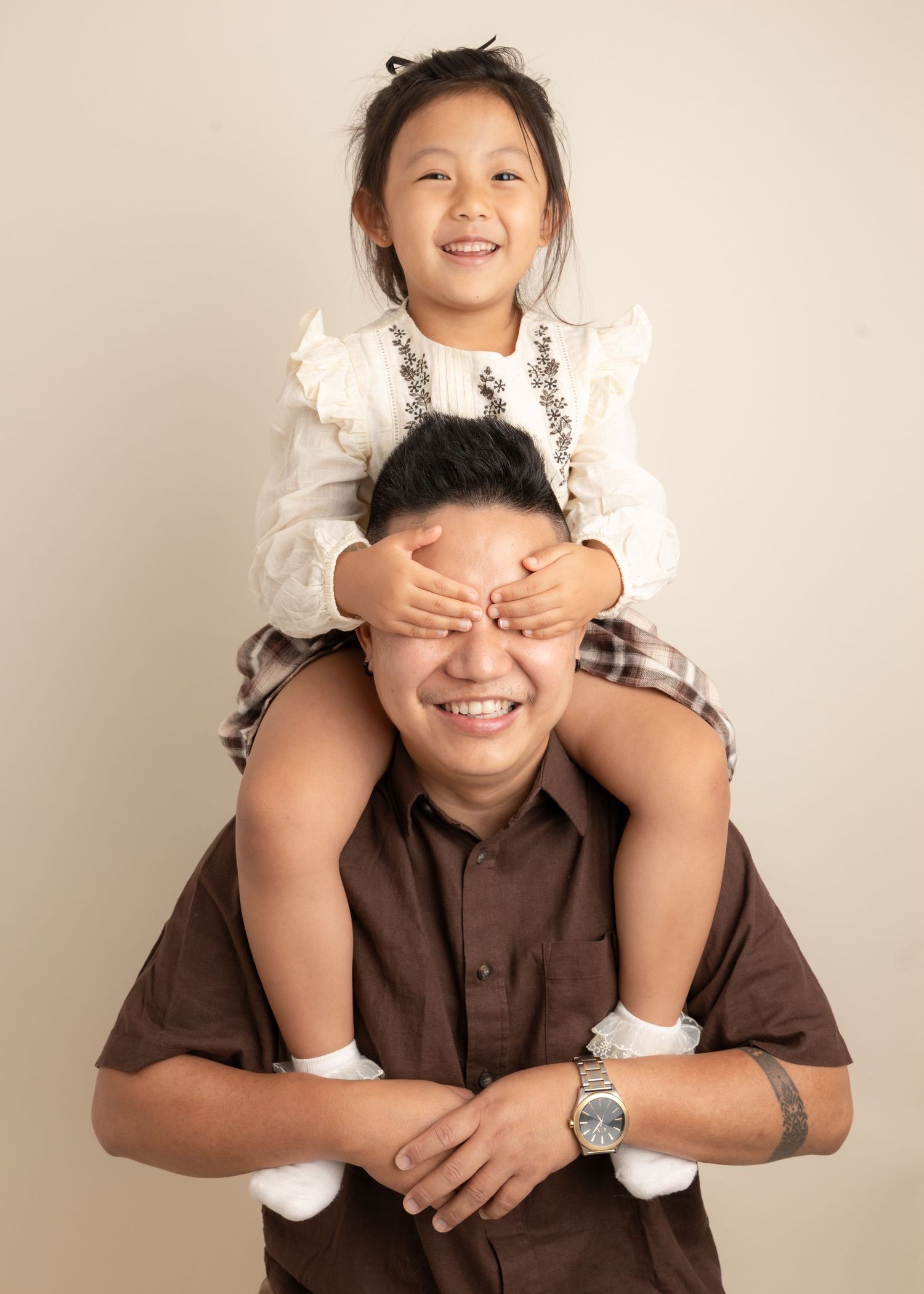 Daughter on Daddy's shoulders
