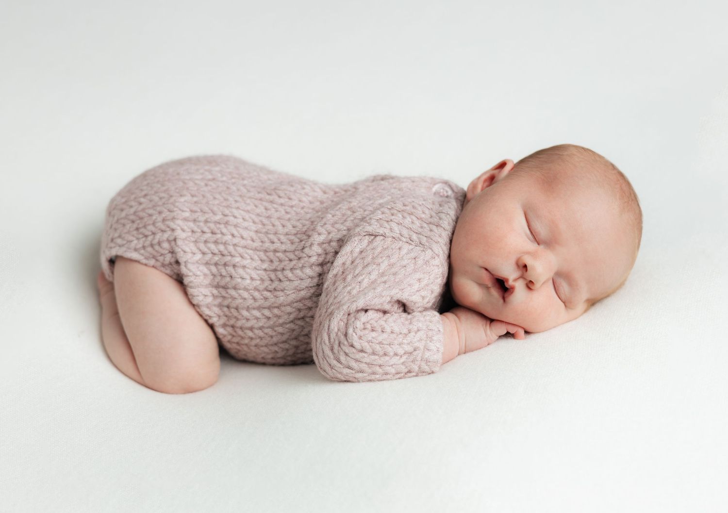 Newborn scrunch curled up like in womb