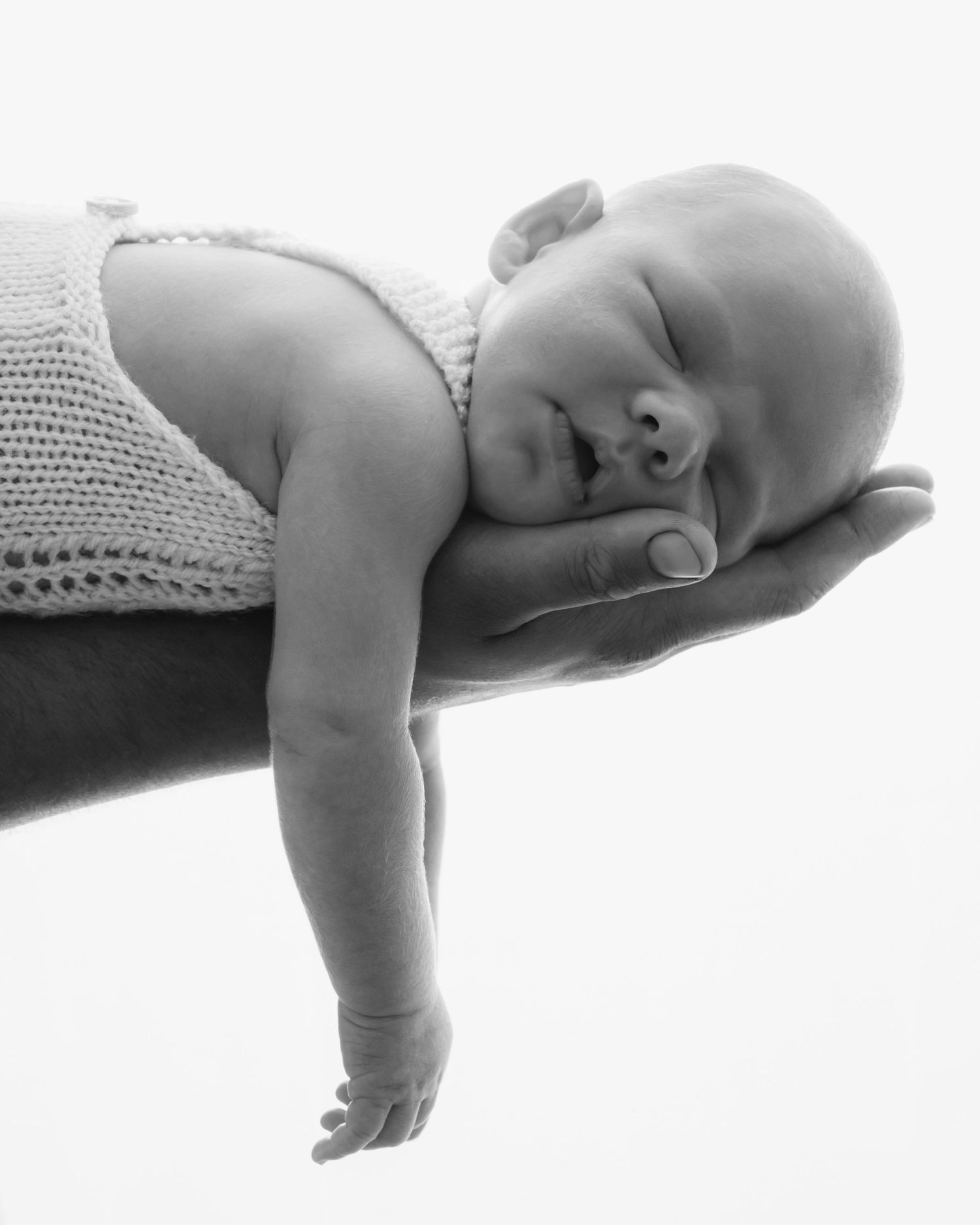 Dad holding newborn baby