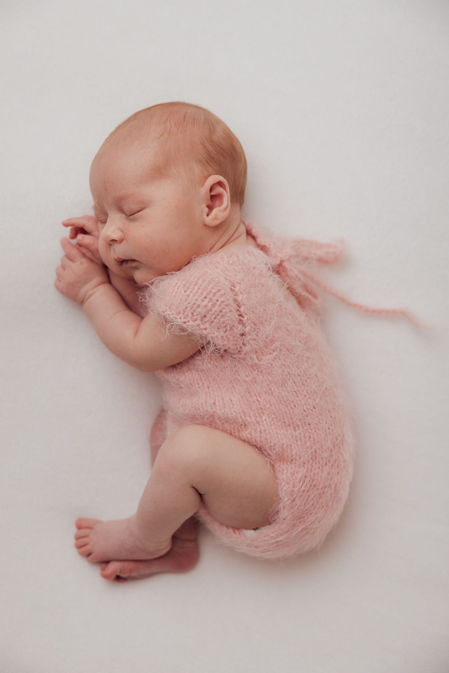 Curled up newborn