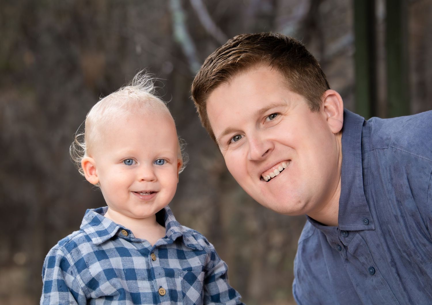 Candid family photo of kids playing and laughing during a portrait session.
