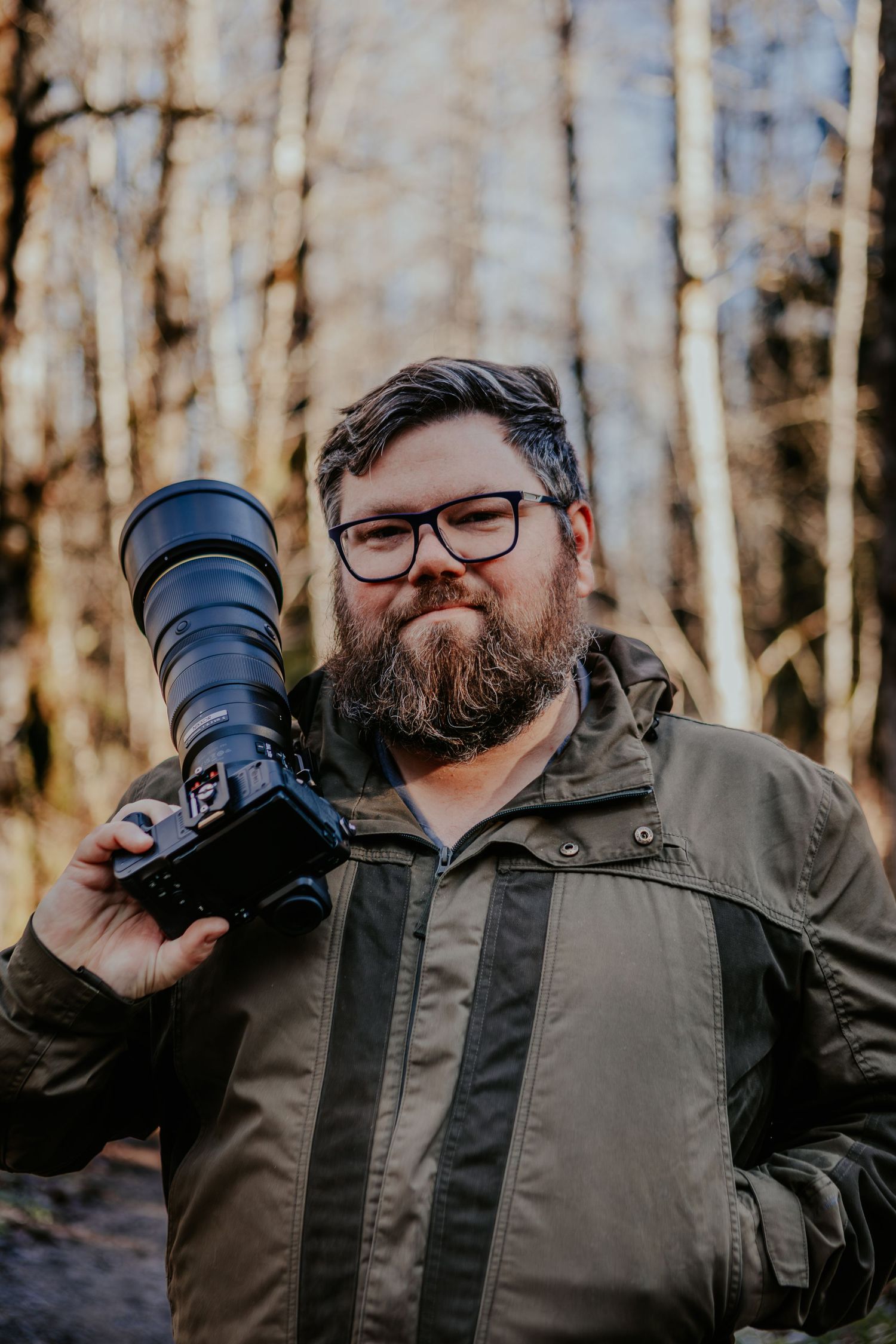 Portrait of photographer Brandon from Axe & Anchor Photography in natural light.