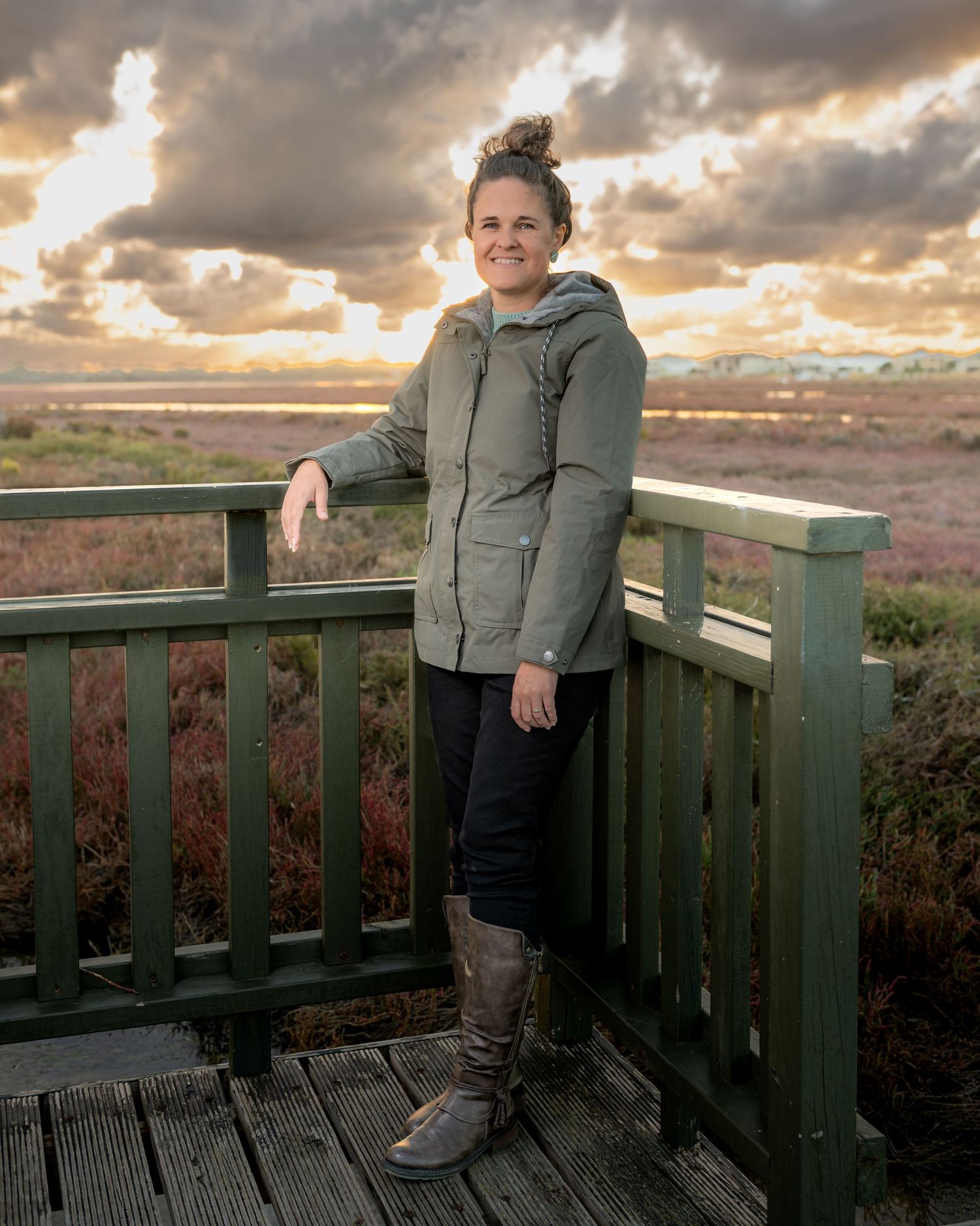 Outdoor portrait of a woman captured in natural, golden‑hour light.