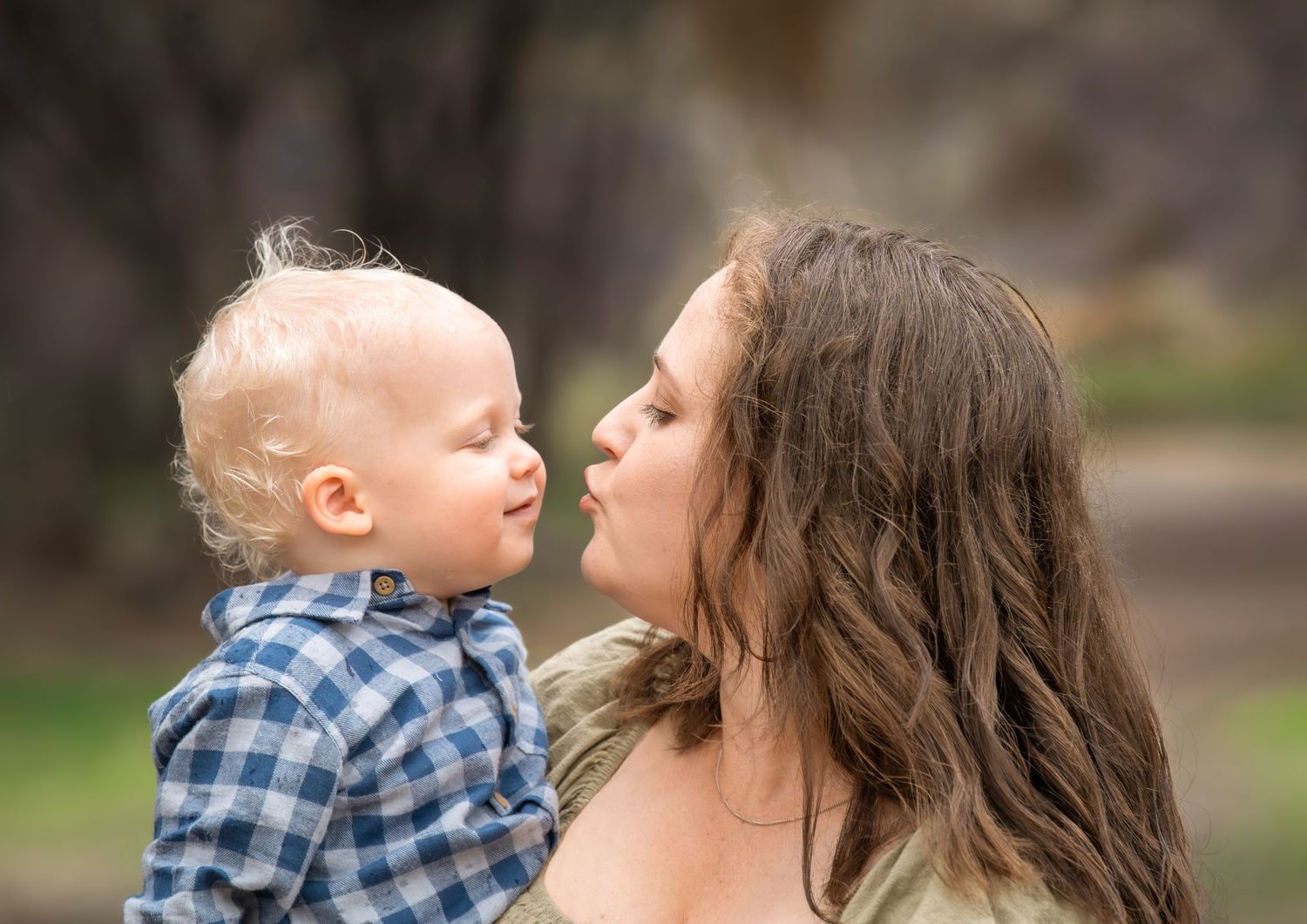 Candid family photo of kids playing and laughing during a portrait session.