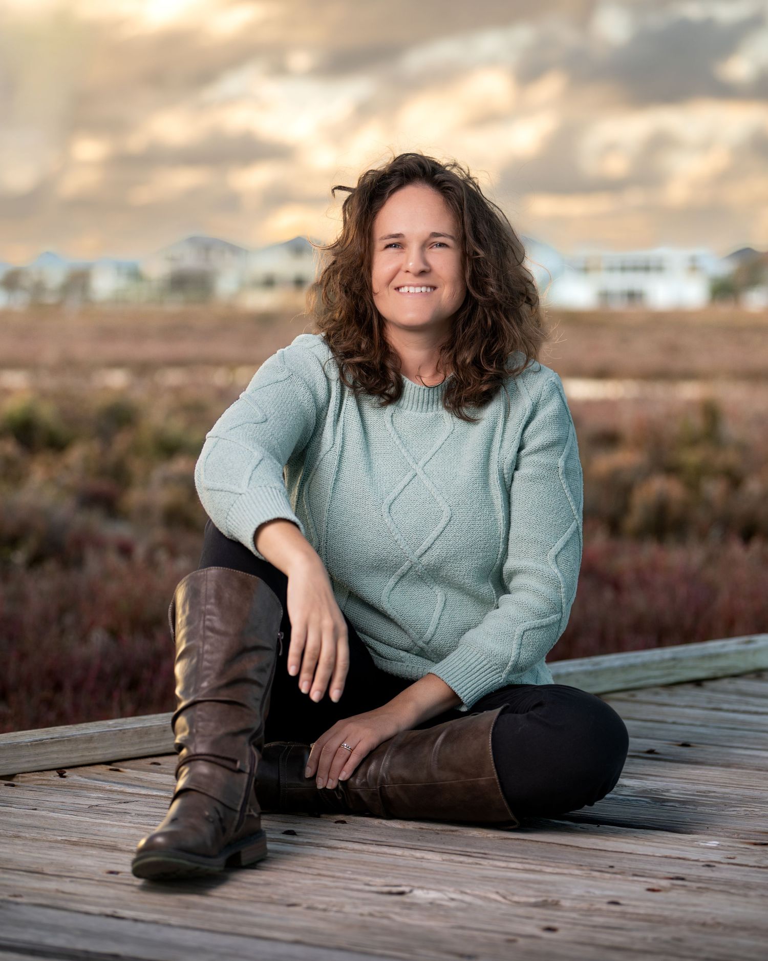 Outdoor portrait of a woman captured in natural, golden‑hour light.