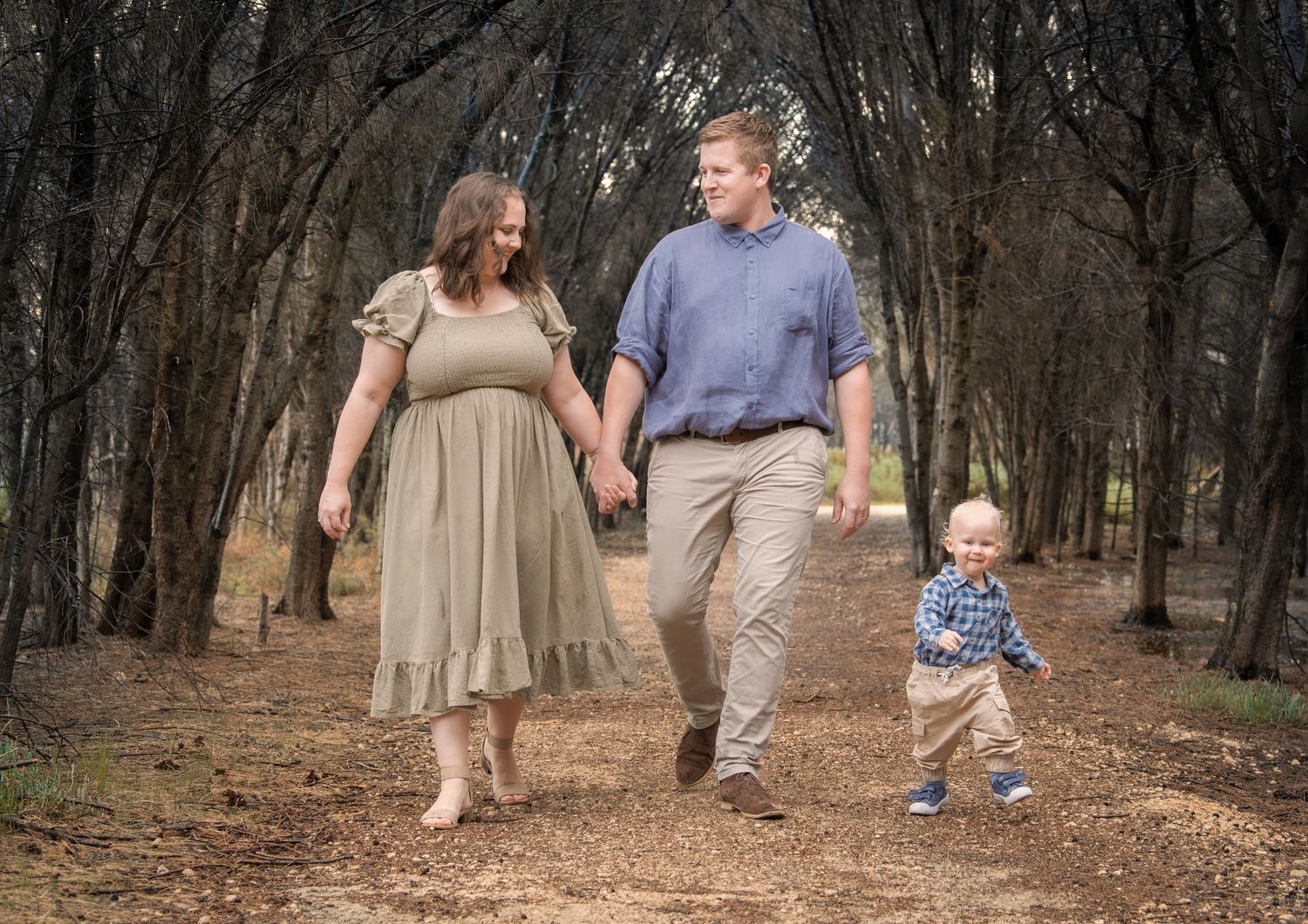 Candid family photo of kids playing and laughing during a portrait session.