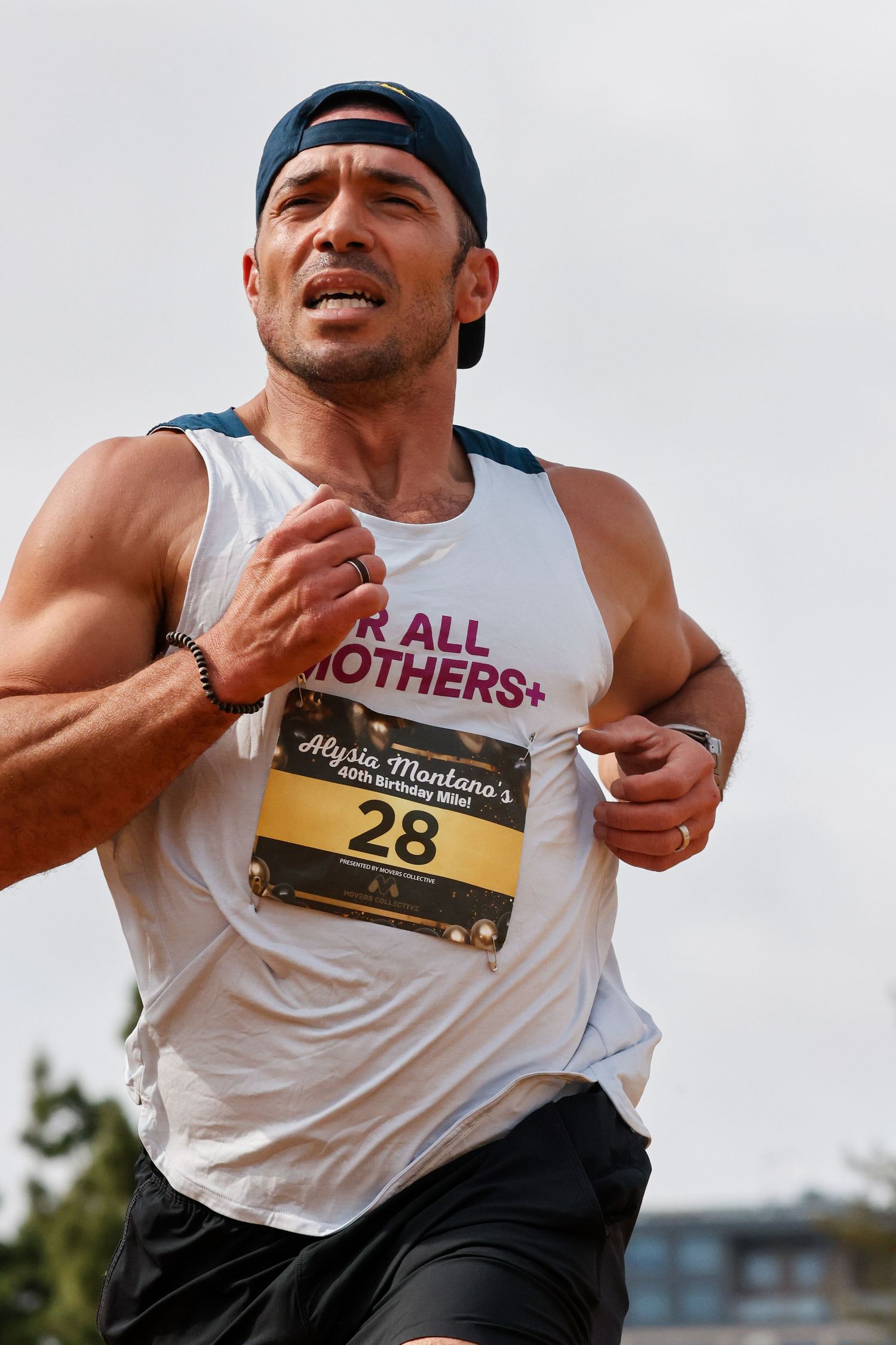 Male runner wearing bib 28 competing in Alysia Montano's race event.