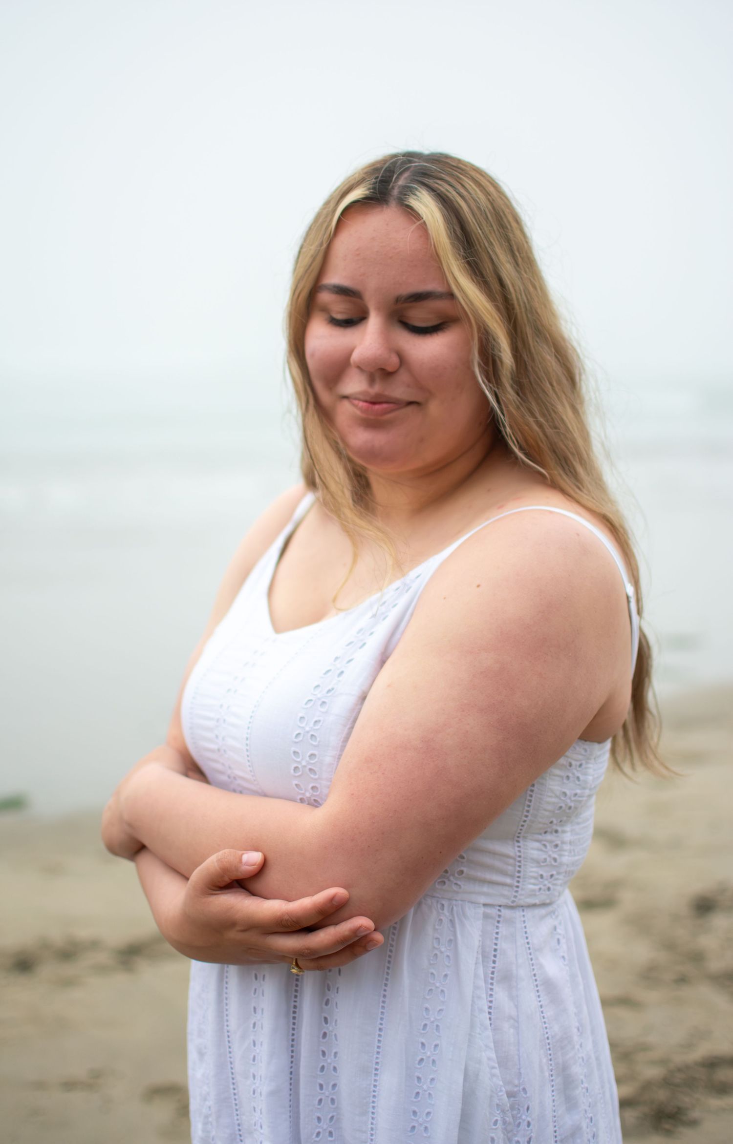 Close up of high school senior girl at beach in Newport Oregon.