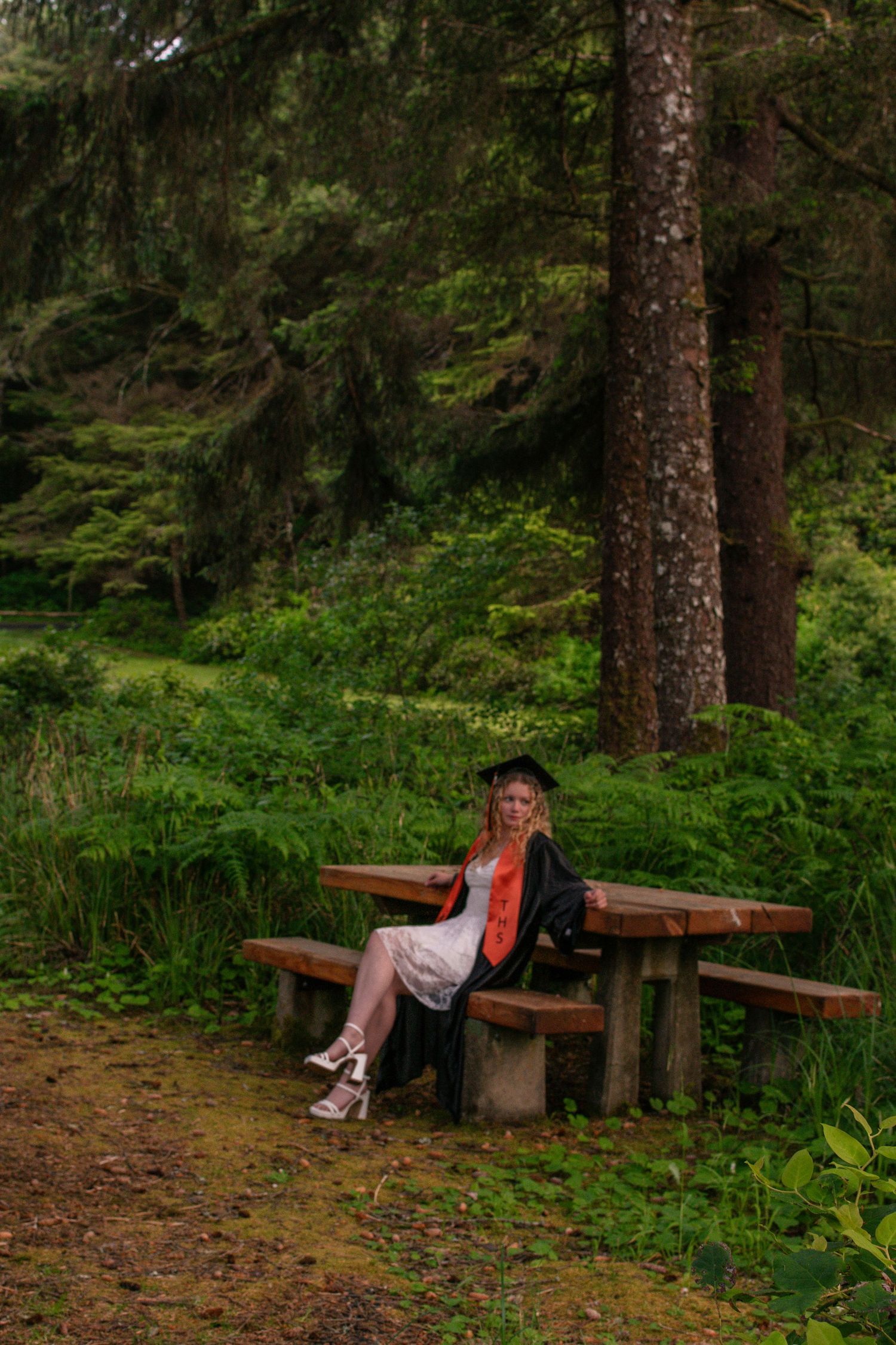 Angilea posing casually for her Newport Oregon senior pictures.