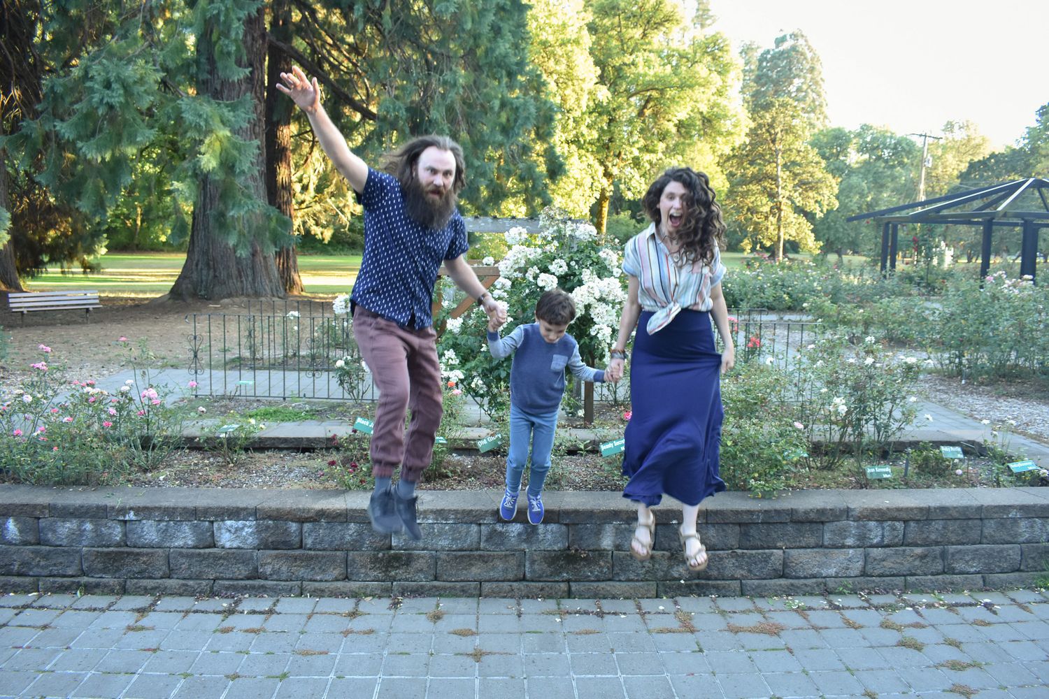 Family jumping during family portrait session in Corvallis Oregon.
